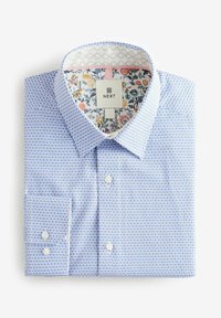 Chemise à carreaux bleue et blanche avec col boutonné. L'intérieur présente un motif floral. Fabriquée en tissu tissé à la texture lisse.