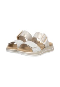 Sandales blanches avec des lanières métalliques dorées, devant à motif et une large boucle carrée. Semelle intérieure douce et rembourrée avec des semelles profilées.