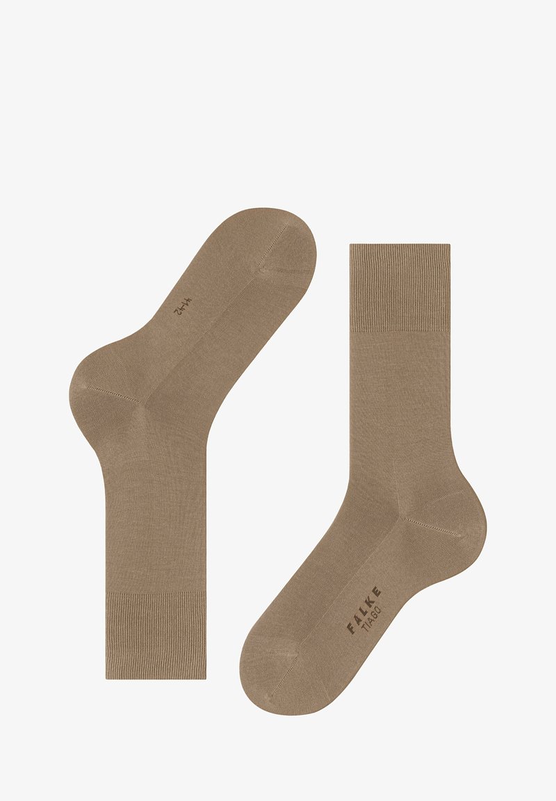 Calze crew beige realizzate in un materiale liscio ed elastico. Presentano un bordo a costine e una punta senza cuciture per il massimo comfort. Logo del marchio stampato di lato.