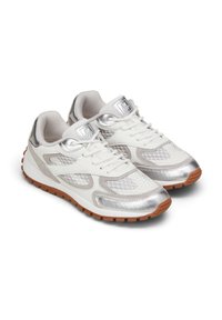 White athletic shoes with silver accents, mesh texture, and a rubber sole. Features a lace-up design and logo detail on the tongue.