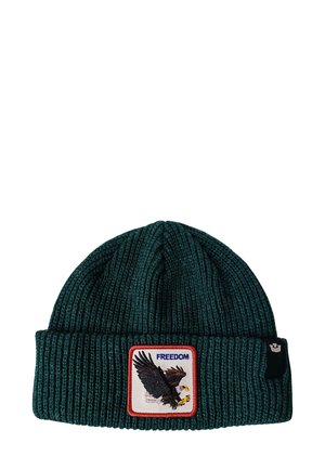 Cappello in maglia di colore verde scuro con trama a costine, caratterizzato da un distintivo in evidenza che mostra un'aquila e la parola "LIBERTÀ" in blu.