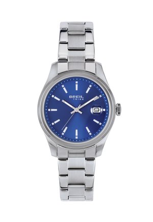 Sølv metal armbåndsur med blå urskive, hvide timemarkører, datovisning ved kl. 3 og mærkenavnet "Breil Tribe" på urskiven.