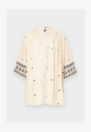 Svetlo béžové kimono s otvoreným predným dielom, s čiernymi potlačami palmových stromov roztrúsenými a s čiernymi geometrickými vzormi na širokých rukávoch.