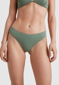 Olivgrön baddräktstrosa i ett mjukt, stretchigt material. Har en måttlig höjd och sömlös design för komfort och täckning.