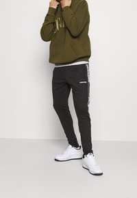 Pegador Träningsbyxor - black