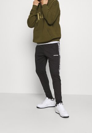 Pegador Pantalones deportivos - black
