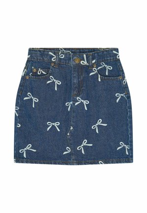 Denim mini skirt with front pockets, button, zipper, and white bow patterns printed all over the fabric.
