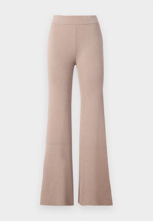 Beige ribbed knit pants with a high elastic waistband and flared legs, shown against a white background.