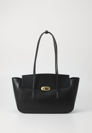 Black leather shoulder bag with long straps and a gold oval clasp on a plain light gray background.