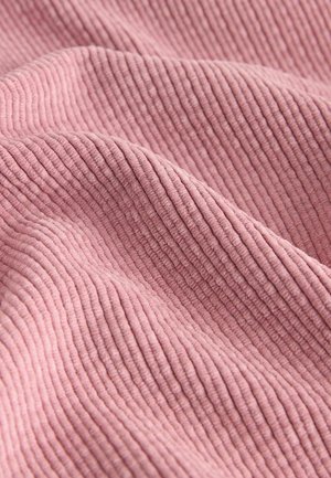 Textured, pink fabric with vertical ribbed patterns. Soft, draped appearance, with a smooth surface and subtle sheen.