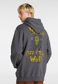 Gray hooded sweatshirt with a graphic design featuring a skull and spiderweb on the back. Cotton material, relaxed fit, front kangaroo pocket.