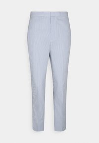 Pruhované kalhoty s úzkým střihem, s modro-bílým vertikálním pruhem, hladkou látkou a ohnutým lemem nad kotníky.