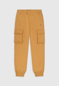 Gelbe Baumwoll-Jogginghosen mit Kordelzugbund, ausgestattet mit zwei seitlichen Cargo-Taschen, gerippten Bündchen und einem kleinen Logo auf einer Tasche.