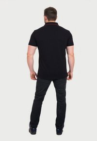 U.S. Polo Assn. Bluză polo - schwarz