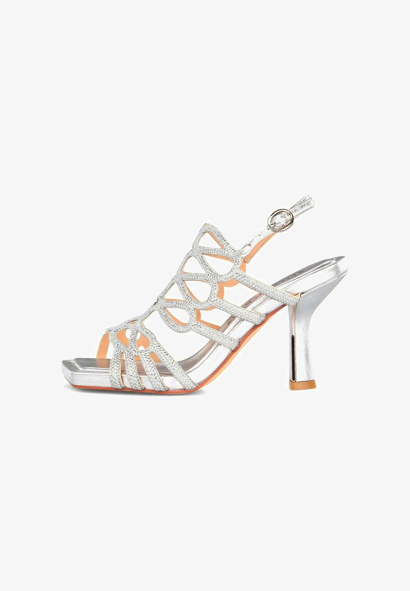 Silberne High-Heels Sandale mit offener Zehe, mit Strass besetzten, kreuzweise verlaufenden Riemen und einer verstellbaren Fessel-Schließe.