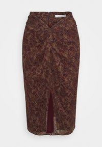 Brun mönstrad midikjol i blommönster med slits fram och rynkdetalj i midjan, med en dragkedjestängning i ryggen.