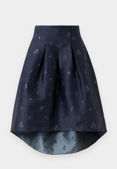 Navy blue high-low skirt with pleats and subtle playing card suits pattern in a slightly shiny fabric.