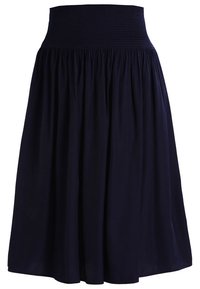Midi-length navy blue skirt with a wide smocked waistband and gathered fabric for a flowing silhouette.