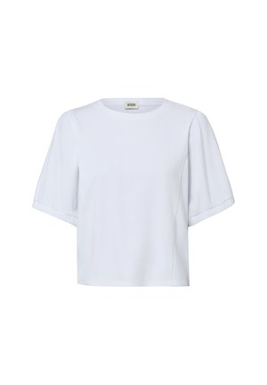 Blouse blanche à manches courtes avec encolure ronde et manches légèrement bouffantes, confectionnée en tissu lisse, présentée sur un fond uni.