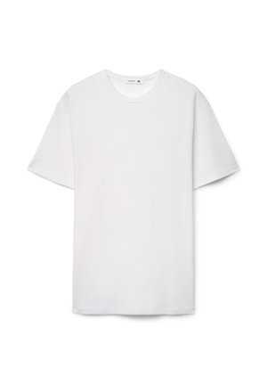 T-shirt bianca a maniche corte in tessuto strutturato con scollo rotondo. Etichetta della taglia visibile all'interno del colletto, orlo dritto sul fondo.