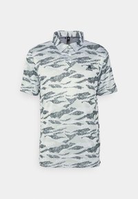 Polo tričko v světle šedé barvě s černým a šedým vlnitým maskovacím vzorem. Má límeček, krátké rukávy a logo Adidas na hrudi.