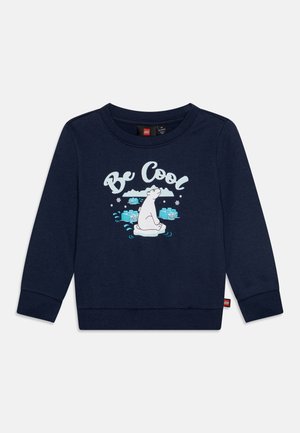 Marineblå langærmet baby-sweatshirt med teksten "Be Cool" og en hvid isbjørn, der sidder på isflager omgivet af snefnug og vand.