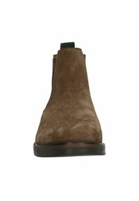 Stivali alla caviglia in suede marrone con una texture liscia, pannelli laterali elastici e una linguetta sul retro. Suola piatta in gomma e punta a forma di mandorla.