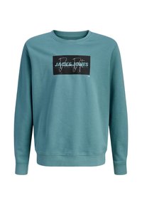 Πράσινο βαμβακερό φούτερ με μακριά μανίκια. Διαθέτει ένα μαύρο ορθογώνιο γραφικό με λευκό και μπλε κείμενο στο μπροστινό μέρος. Κλασικός σχεδιασμός με στρογγυλή λαιμόκοψη.