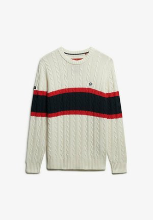 Sweter w warkocze w kolorze ecru z granatowymi i czerwonymi poziomymi paskami. Posiada okrągły dekolt oraz ściągacze przy mankietach i u dołu.