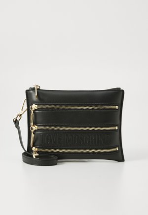 Black faux leather pouch with three zippered compartments and embossed logo. Features gold-tone hardware and detachable shoulder strap.