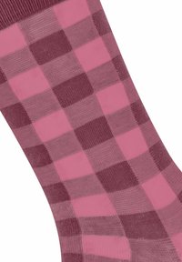 Chaussettes à carreaux violettes et roses en matériau lisse et extensible. Présentent des motifs de carrés alternés et un poignet côtelé.