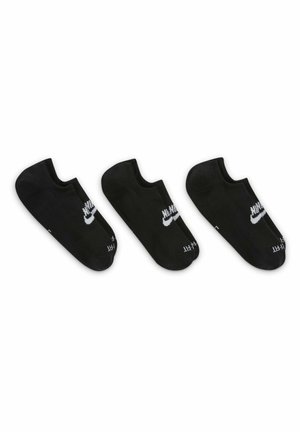 Calcetines negros hasta el tobillo con textura acanalada, con un logo blanco de Nike en cada lado. Se muestran tres pares, todos idénticos en diseño.