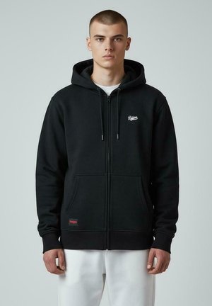 Hoodie noir zippé en mélange de coton, doté d'une poche avant, d'une capuche avec cordon de serrage et d'un petit logo blanc sur la poitrine.