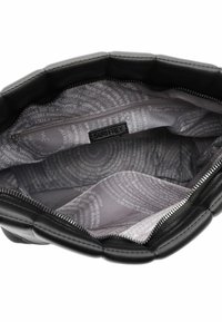 Black handbag interior with a zipper, featuring a textured design, gray lining with white text, and one zippered pocket.