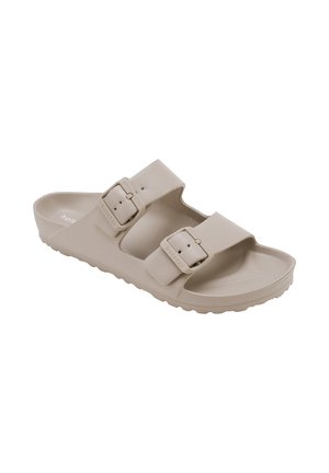 Sandalia beige sin cordones con dos correas ajustables con hebilla y plantilla contorneada para uso informal.