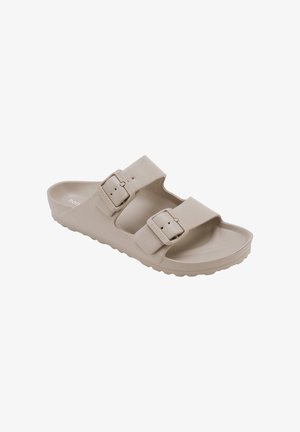 Sandalia beige sin cordones con dos correas ajustables con hebilla y plantilla contorneada para uso informal.