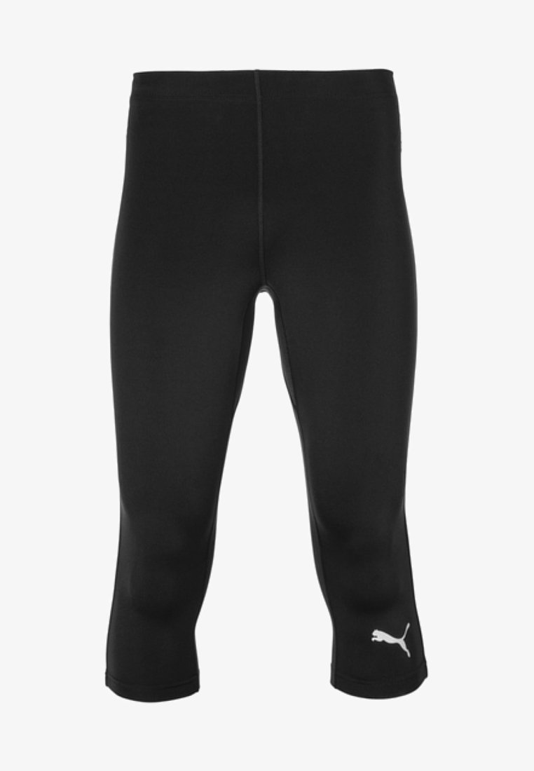 Mustat capri-legginssit, jotka on valmistettu sileästä ja joustavasta kankaasta. Niissä on valkoinen Puma-logo vasemmalla puolella ja ne ovat muotoiltuina.