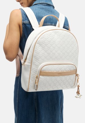 White faux leather backpack with textured pattern, tan accents, gold hardware, and a front zipper pocket. Adjustable straps included.