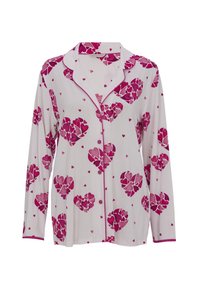 Dames pyjama-top met lange mouwen in witte stof, met meerkleurige roze hartjespatronen en een roze rand langs de kraag en knopen.
