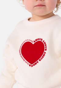 Petit Bateau BÉBÉ MOLLETON - Melegítőfelső - milk