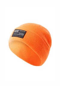 Orange knitted beanie with a ribbed texture. Features a black fabric label with white text detailing brand and coordinates.