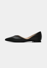 Black leather ballet flats with a pointed toe, low heel, smooth texture, and a slight cutout at the instep, featuring a beige interior.