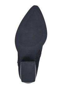 Black high-heeled shoe with a textured fabric upper and a solid rubber sole. The heel is a block shape, providing stability.