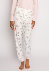 Vita pyjamasbyxor med färgglada elefantmönster och rosa hjärtan, med en avslappnad passform, elastisk midja och snörningsdetalj.