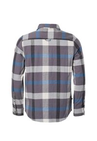 Chemise à manches longues boutonnée avec un grand motif à carreaux bleu, gris, noir et blanc, vue de dos.