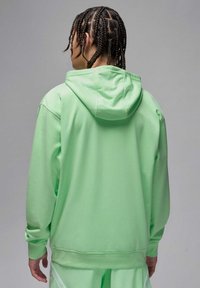 Felpa con cappuccio verde chiaro dalla vestibilità comoda, caratterizzata da un design semplice, una texture morbida e polsini a costine. Decorata con una tasca a marsupio.