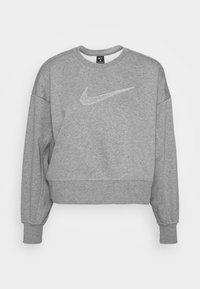 Szary skrojony sweatshirt z długimi rękawami, ściągaczami oraz dużym, błyszczącym białym logo Nike na klatce piersiowej. Wykonany z miękkiego materiału.
