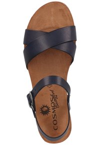 Dunkelblaue Ledersandale mit kreuzenden Riemen, verstellbarem Schnallenverschluss und einem naturbelassenen Velourledersohle mit einem Sonnenmuster.