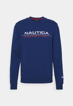 Sweatshirt Nautica en bleu marine, doté d'un col rond et de manches longues. Logo "Nautica Competition" en blanc et rouge sur la poitrine.