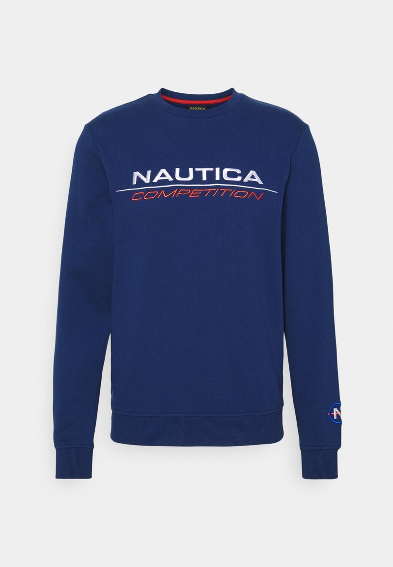 Nautica mikina v námořnické modři, má kulatý výstřih a dlouhé rukávy. Na hrudi je logo "Nautica Competition" v bílé a červené barvě.